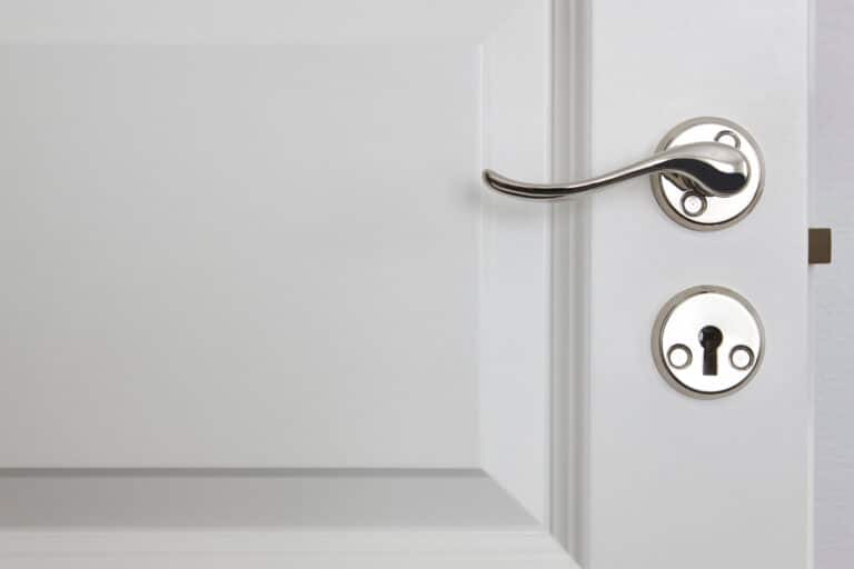 A Metal Door Handle On a Composite Door